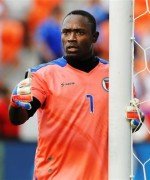 Haiti goalkeeper Frandy Montrevil arranges his players as he awaits a corner kick against El Salvador during the first half of a CONCACAF Gold Cup soccer match on Monday, July 15, 2013, in Houston. (AP Photo/Bob Levey)